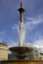 Fountain in Trafalgar square with nelsons column in background Royalty Free Stock Photo