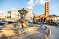 Fountain of the Tritons and Church of Santa Maria in Cosmedin in Rome Royalty Free Stock Photo