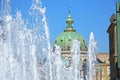 Fountain of water with Amalienborg Palace Square and a statue of Frederick V on a horse in the background, Copenhagen, Denmark Royalty Free Stock Photo