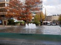 Fountain water feature with trees in autumn colours in Sheffield city centre Royalty Free Stock Photo