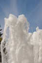 Fountain water jet close up on blue sky background Royalty Free Stock Photo