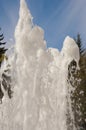 Fountain water jet close up on blue sky background Royalty Free Stock Photo