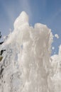 Fountain water jet close up on blue sky background Royalty Free Stock Photo