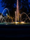 Fountain with water jets and lights at night Royalty Free Stock Photo