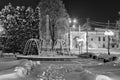 Fountain in the winter park at night Royalty Free Stock Photo
