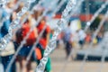 Spray fountain in the city center with selective focus and blurred background. Image of a water jet in a fountain Royalty Free Stock Photo