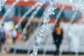 The fountain works with splashes and drops of water. Image of a water jet in a fountain. Frozen movement. Royalty Free Stock Photo