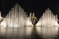 Fountains in action during night show in Dubai downtown