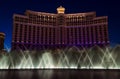 The Bellagio Hotel fountain show dances beneath a night sky.