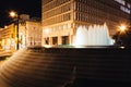 Fountains and buildings at night at Woodruff Park in downtown At