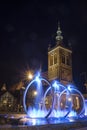 Fountains and historical bell tower in Gdansk at night. Poland
