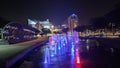 fountains, water at night in the city, red purple color