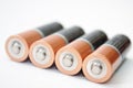 Four AA alkaline batteries on a white background