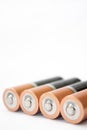 Four AA alkaline batteries on a white background