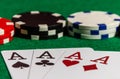 Four ace cards on the background of poker chips in a casino Royalty Free Stock Photo