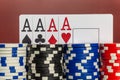 Four ace cards on the background of poker chips in a casino Royalty Free Stock Photo