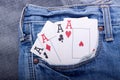 Four aces in blue jeans pocket Royalty Free Stock Photo