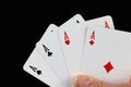A four aces card-hand on a black background Royalty Free Stock Photo