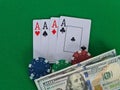 Four of aces in a deck of playing cards and chips for playing poker Royalty Free Stock Photo