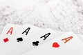 Four aces of different suits isolated on white background macro view Royalty Free Stock Photo
