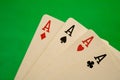 Four aces on green background casino games fortune luck Royalty Free Stock Photo