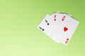 Four aces on green background. Concept of gambling risk