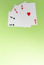 Four aces on green background. Concept of gambling risk. From above. Copy space