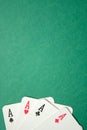 Four aces on a green background. Top view. Copy space. Vertical Royalty Free Stock Photo