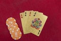 Four aces near stacks of chips on a red felt table Royalty Free Stock Photo