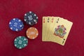 Four aces near stacks of chips on a red felt table Royalty Free Stock Photo