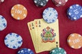 Four aces near stacks of chips on a red felt table Royalty Free Stock Photo