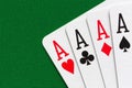 Four aces over green textile background Royalty Free Stock Photo