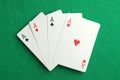 Four aces playing cards on green table, top view. Poker game Royalty Free Stock Photo