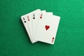 Four aces playing cards on green table. Poker game Royalty Free Stock Photo