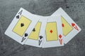 Four aces playing cards on grey background. Poker play in casino Royalty Free Stock Photo