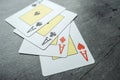 Four aces playing cards on grey background. Poker play in casino Royalty Free Stock Photo