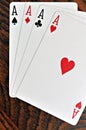 Four Aces - Playing Cards on Wooden Royalty Free Stock Photo