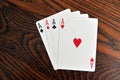 Four Aces - Playing Cards on Wooden Royalty Free Stock Photo