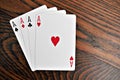 Four Aces - Playing Cards on Wooden Royalty Free Stock Photo