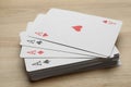 Four aces playing cards on wooden table, closeup Royalty Free Stock Photo