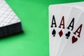 Four aces poker cards against green background. Four of a kind combination in poker game. Poker combinations concept Royalty Free Stock Photo