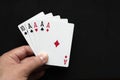 Four aces poker cards close up on black background. Four of a kind conbination in pocker game. Royalty Free Stock Photo