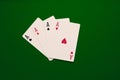 Four aces poker cards close up on green backgorund. Four of a kind conbination in pocker game. Royalty Free Stock Photo