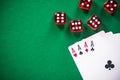 Four aces poker cards and red dices on casino table Royalty Free Stock Photo