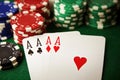 Four aces winning hand on green poker table with chips Royalty Free Stock Photo