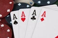 Four aces winning hand on a pile of betting chips Royalty Free Stock Photo