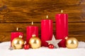 Four advent candles with christmas balls and stars Royalty Free Stock Photo