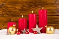 Four advent candles with christmas balls and stars Royalty Free Stock Photo