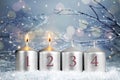 Four Advent candles. Two candles burning. Second week of Advent Royalty Free Stock Photo