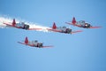 Four Aerobatic Aircraft in Flight at an Air Show